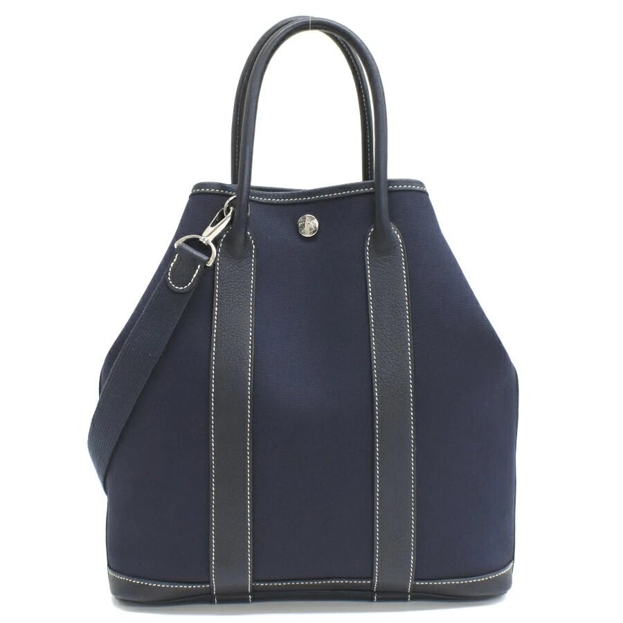 HERMES GARDEN FILE PM TOTE SHOULDER BAG: Hermes Garden File PM Tote Shoulder Bag Brand: Hermes Type/Style: Bag Material: Exterior Material Toile Officier Cotton Leather Color: Exterior Color Navy Size: H (Height): 29cm ? W (Width): 27cm ? D 