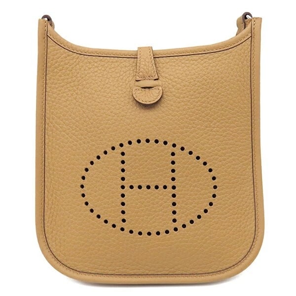 HERMES EVELYNE TPM 16 SHOULDER BAG: Hermes Evelyne TPM 16 Shoulder Bag Brand: Hermes Type/Style: Bag Material: Exterior Material Taurillon Clemence Leather Color: Exterior Color Biscuit Size: Height: 7.5 inches (19 cm) Width: 6.3 inches