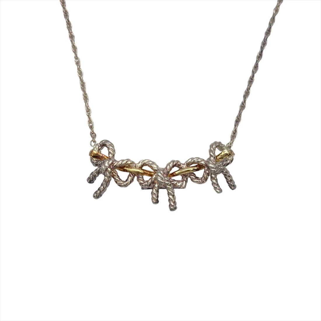 TIFFANY & CO. TWIST TRIPLE RIBBON NECKLACE: Tiffany & Co. Twist Triple Ribbon Necklace Brand: Tiffany Type/Style: Necklace Material: Gold (18K) Silver 925 Color: Gold, Silver Size: Neck Circumference 46 cm / 18.11'' Pendant Size 16.1mm x 34mm /
