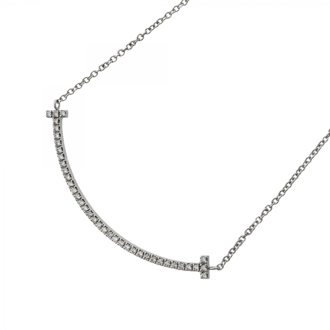 TIFFANY & CO. T SMILE SMALL NECKLACE: Tiffany & Co. T Smile Small Necklace Brand: Tiffany Type/Style: Necklace Material: White gold (18K) Main Stone Natural Color: White gold Size: Neck Circumference 40.5 cm / 15.94'' Pendant Size 10mm x