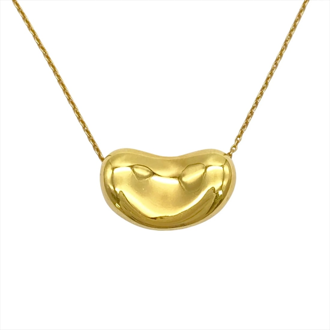 TIFFANY & CO. BEAN LARGE DESIGN NECKLACE: Tiffany & Co. Bean Large Design Necklace Brand: Tiffany Type/Style: Necklace Material: Color: Yellow gold Size: Neck Circumference 39 cm / 15.35'' Pendant Size 11.5mm x 20.5mm / 0.45'' x 0.8''