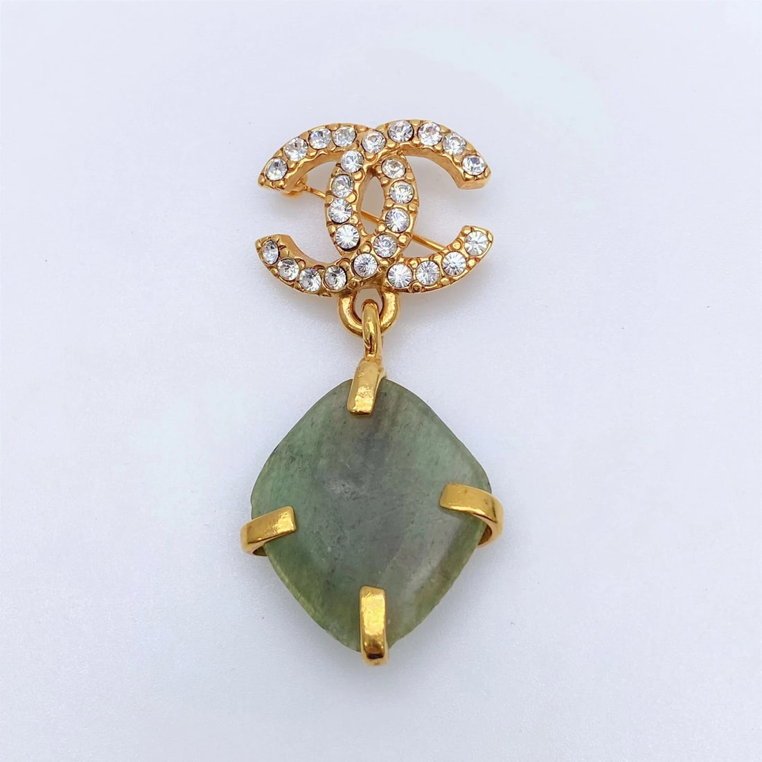 CHANEL RHINESTONE BROOCH: Chanel Rhinestone Brooch Brand: CHANEL Type/Style: Brooch Material: Not specified Color: none Size: None Accessories: None Accessories Notice: When purchasing pre-owned goods, please refer to the
