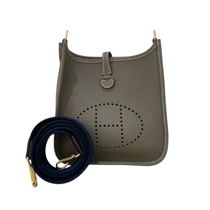 HERMES EVELYNE TPM CROSSBODY SHOULDER BAG: Hermes Evelyne TPM Crossbody Shoulder Bag Brand: Hermes Type/Style: Bag Material: Exterior Material Taurillon Clemence Leather Color: Exterior Color Etoupe Hardware: Gold Size: Height: 6.7 inches (17 