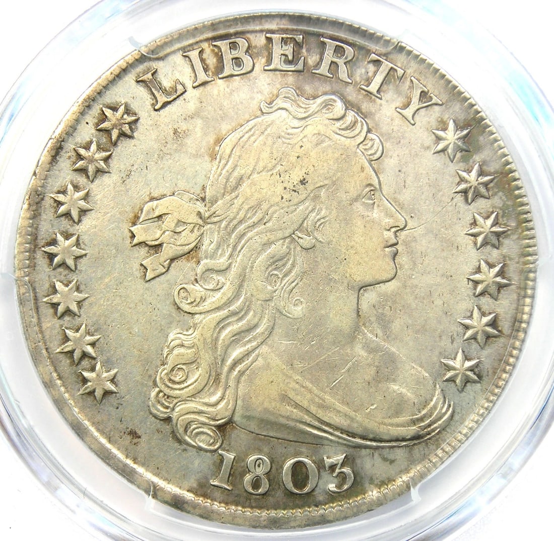 1803 DRAPED BUST SILVER DOLLAR $1 COIN: 1803 Draped Bust Silver Dollar $1 Coin Year : 1803 Denomination : $1 Country of Origin : United States Accessories: None Accessories Notice: When purchasing pre-owned goods, please refer to the photos