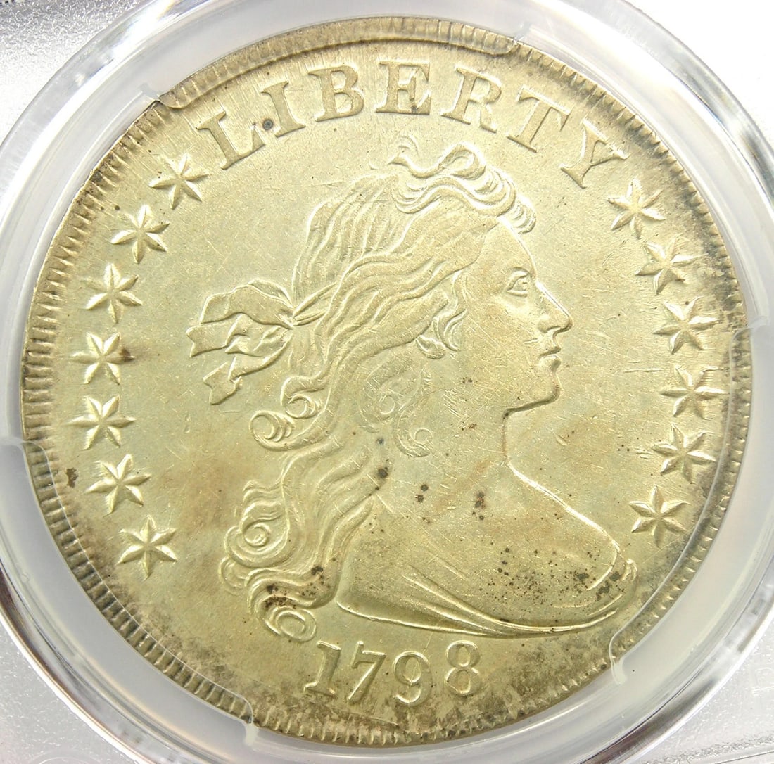 1798 DRAPED BUST SILVER DOLLAR $1 COIN: 1798 Draped Bust Silver Dollar $1 Coin Year : 1798 Denomination : $1 Country of Origin : United States Accessories: None Accessories Notice: When purchasing pre-owned goods, please refer to the photos