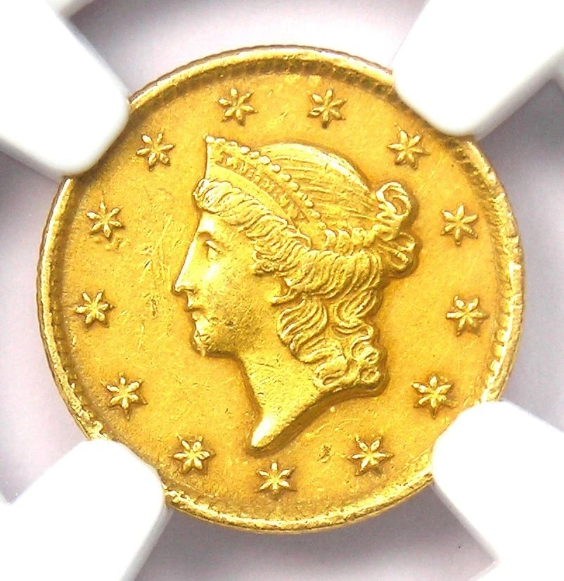 1851-C LIBERTY GOLD DOLLAR G$1 CHARLOTTE COIN: 1851-C Liberty Gold Dollar G$1 Charlotte Coin Year : 1851 Denomination : $1 Country of Origin : United States Accessories: None Accessories Notice: When purchasing pre-owned goods, please refer to