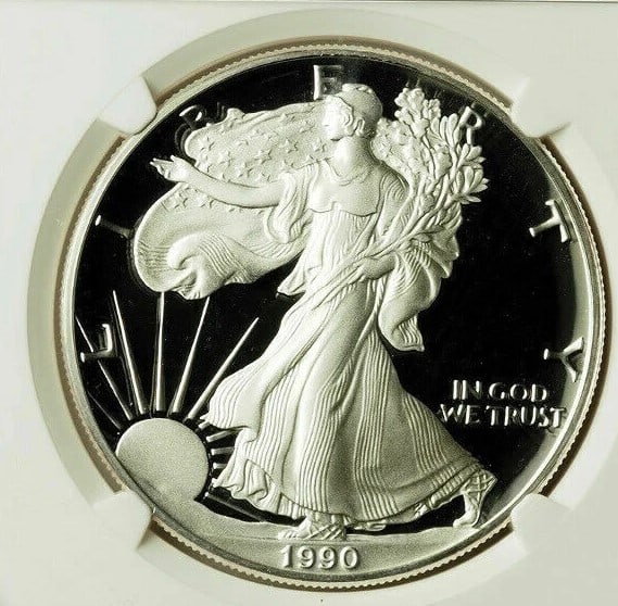 1990-S AMERICAN SILVER EAGLE UCAM JOHN MERCANTI: 1990-S American Silver Eagle UCAM John Mercanti Year: 1990 Composition: Silver Denomination: $1 Country of Origin: United States Accessories: None Accessories Notice: When purchasing pre-owned goods,