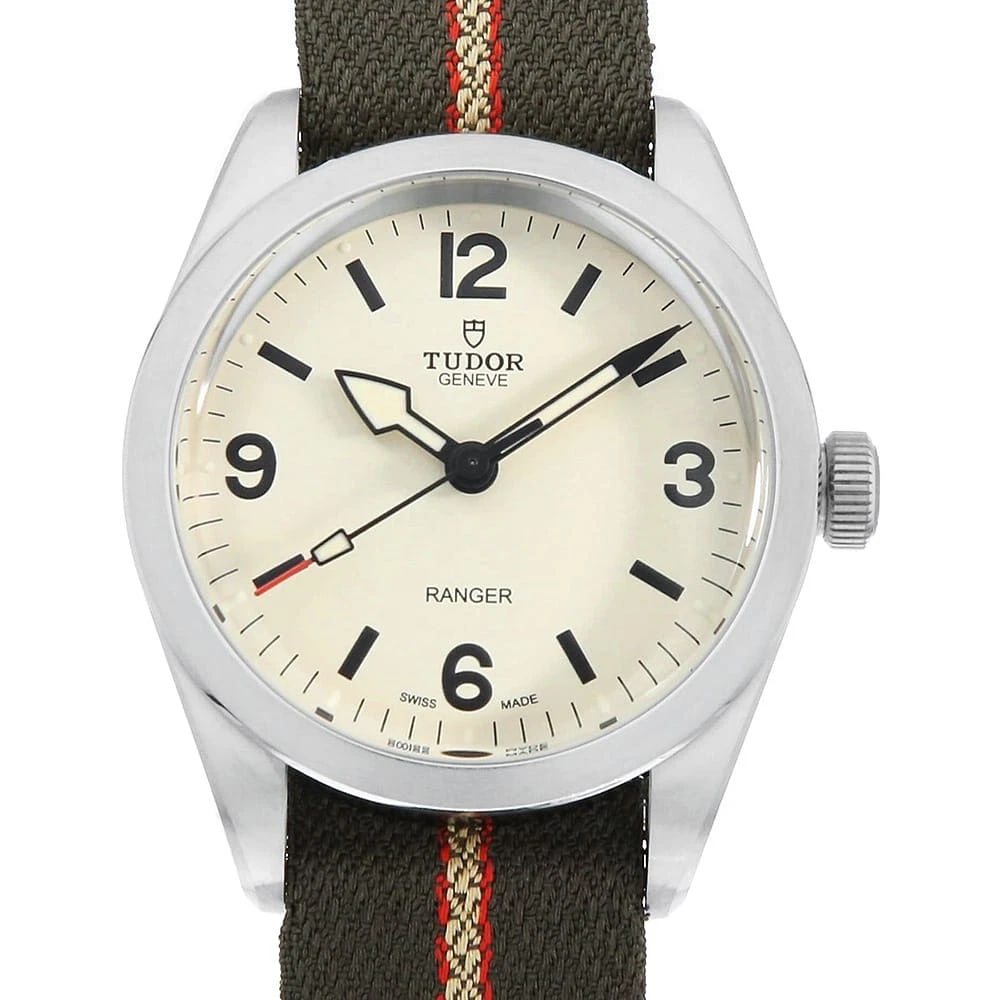 TUDOR RANGER STAINLESS STEEL WATCH: TUDOR Ranger Stainless Steel watch Brand: TUDOR Type/Style: Wrist watch Material: Band Material fabric, Case Material Stainless Steel Color: Dial Color Beige Size: Case:W39mm Accessories: None