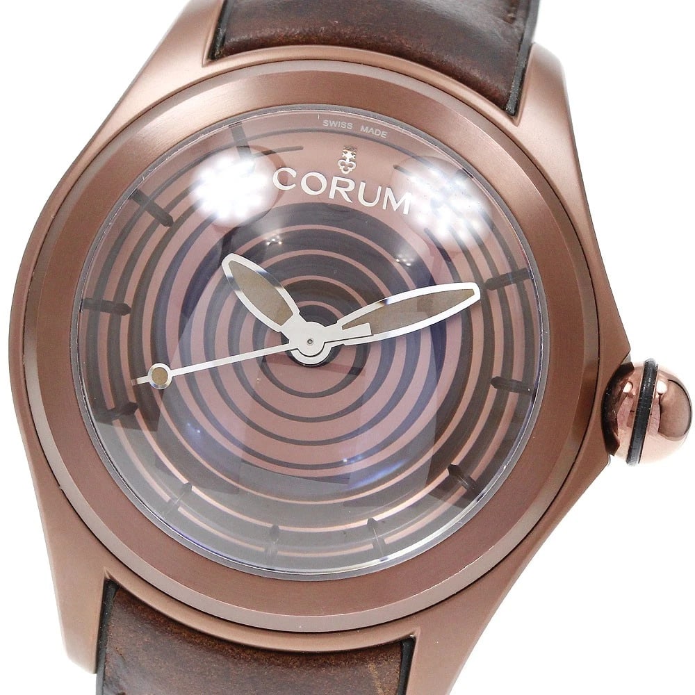 CORUM BUBBLE OPTICAL ART WATCH: CORUM Bubble Optical Art Watch Brand: CORUM Type/Style: Wristwatch Material: Band Material Rubber / leather, Case Material stainless steel Color: Dial Color Brown Size: About 47mm (1.9inch) (not inclu