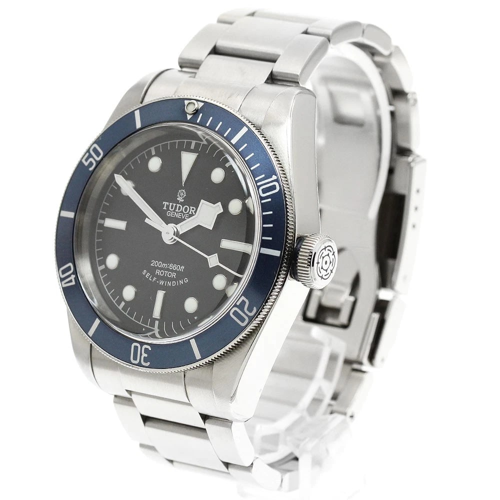 TUDOR HERITAGE BLACK AUTOMATIC WATCH: TUDOR Heritage Black Automatic Watch Brand: TUDOR Type/Style: Wristwatch Material: Band Material Stainless Steel, Case Material Stainless Steel Color: Dial Color black Band Color Silver Case Color