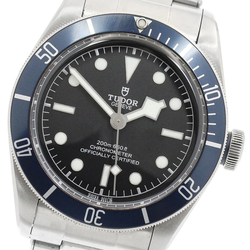 TUDOR HERITAGE BLACK AUTOMATIC WATCH: TUDOR Heritage Black Automatic Watch Brand: TUDOR Type/Style: Wristwatch Material: Band Material Stainless Steel, Case Material Stainless Steel Color: Case Color Silver Band Color Silver Dial Color