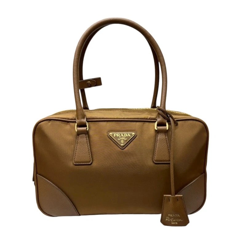 PRADA RE-EDITION HANDBAG: PRADA Re-Edition Handbag Brand: PRADA Type/Style: Handbag Material: Nylon Color: Brown GDHardware Size: W12.2 x H7.1x D3.3inch Shoulder:45.7inch Accessories: None Accessories Notice: When