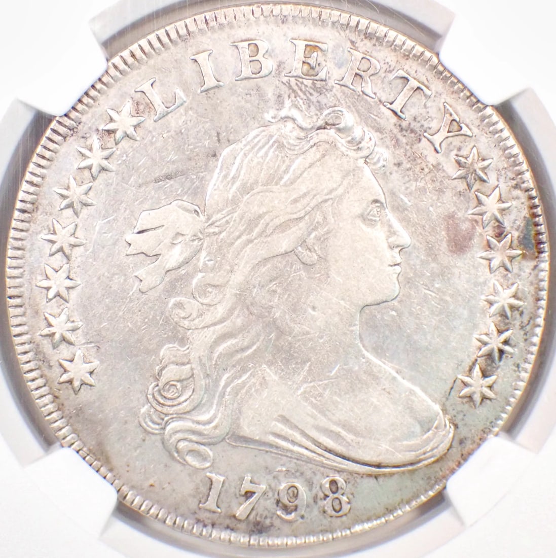 1798 DRAPED BUST SILVER DOLLAR $1 COIN: 1798 Draped Bust Silver Dollar $1 Coin Year : 1798 Denomination : $1 Country of Origin : United States Accessories: None Accessories Notice: When purchasing pre-owned goods, please refer to the photos