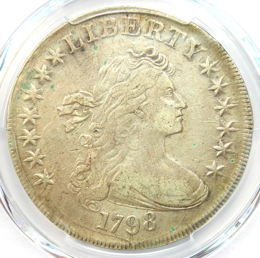 1798 DRAPED BUST SILVER DOLLAR $1 COIN: 1798 Draped Bust Silver Dollar $1 Coin Year: 1798 Denomination: $1 Country of Origin: United States Accessories: None Accessories Notice: When purchasing pre-owned goods, please refer to the photos of