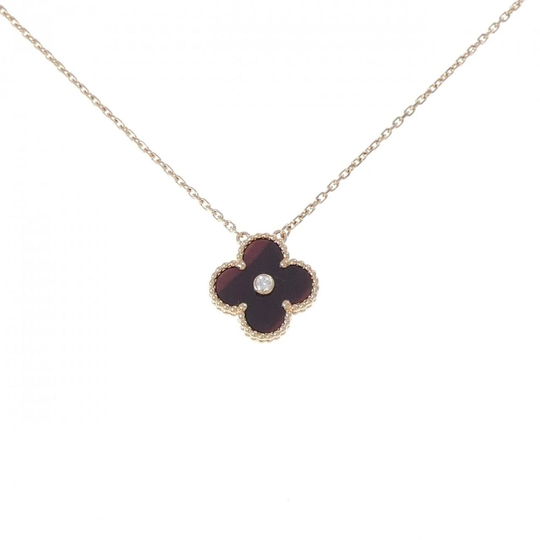VAN CLEEF & ARPELS ALHAMBRA HOLIDAY: Van Cleef & Arpels Alhambra Holiday Brand: Van Cleef & Arpels Type/Style: Van Cleef & Arpels Necklace Material: 750Pink Gold, Main Stone Bullseye Secondary Stone Natural Color: Pink Gold Size: lenth 3