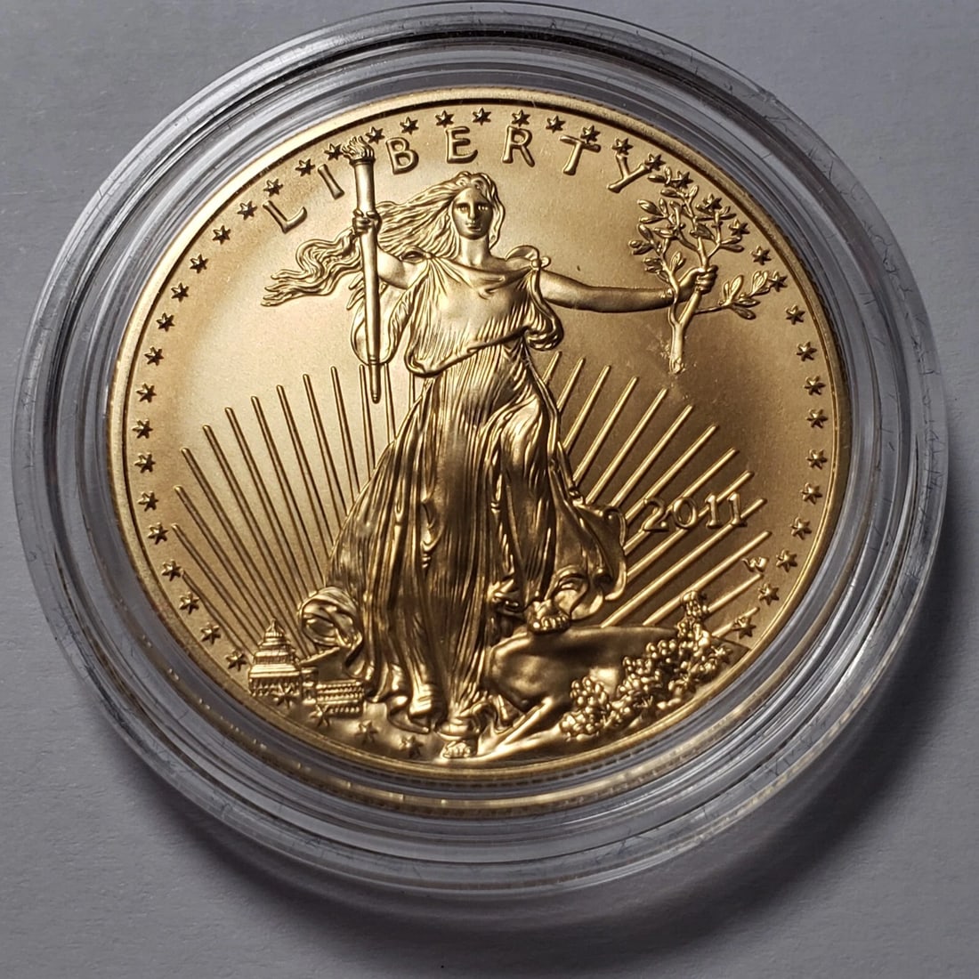 2011-W $50 1 OZ GOLD AMERICAN EAGLE COIN: 2011-W $50 1 oz Gold American Eagle Coin Brand/Mint: U.S. Mint Year: 2011 Fineness: 0.9167 Country of Origin: United States Accessories: None Accessories Notice: When purchasing pre-owned goods, pl