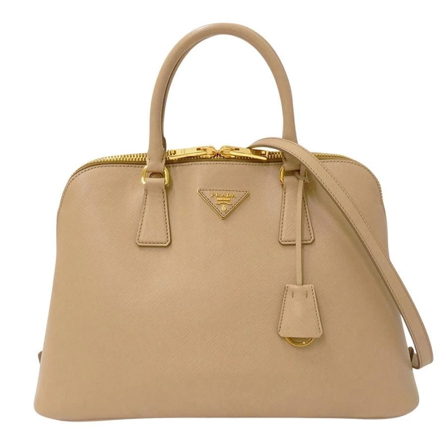 PRADA SAFFIANO PROMENADE HANDBAG: Prada Saffiano Promenade Handbag Brand: Prada Type/Style: Handbag Material: Saffiano Color: Beige Size: W: 34.5cm (bottom) / H: 24cm / D: 14cm (bottom) Accessories: None Accessories Notice: When