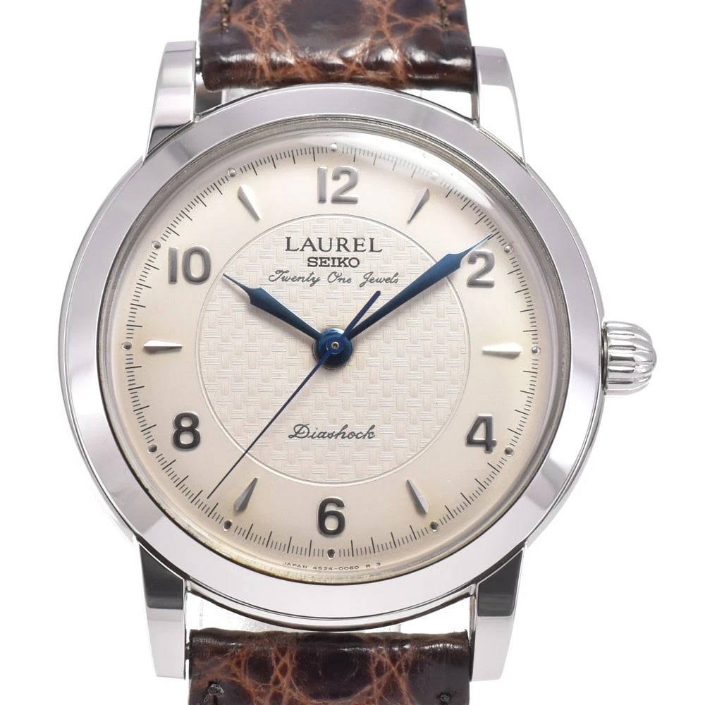 SEIKO LAUREL BACK HAND WINDING WATCH: Seiko Laurel Back Hand Winding Watch Brand: SEIKO Type/Style: Wristwatch Material: Band Material leather, Case Material Stainless Steel Color: Case Color Silver, Band Color Brown, Dial Color Silver Si