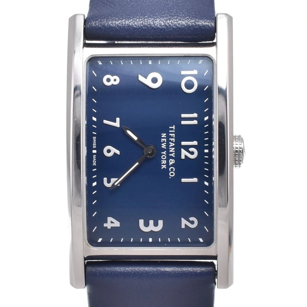 TIFFANY&CO. EAST WEST MINI QUARTZ LADIES WATCH: Tiffany&Co. East West Mini Quartz Ladies Watch Brand: TIFFANY&Co. Type/Style: Wristwatch Material: Band Material leather, Case Material Stainless Steel Color: Case Color Silver, Band Color blue, Dial 