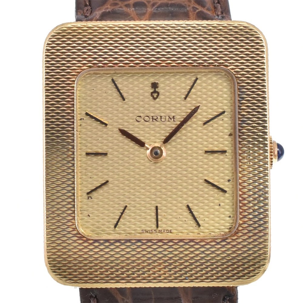 CORUM GOLD DIAL HAND WINDING WATCH: Corum Gold Dial Hand Winding Watch Brand: CORUM Type/Style: Wristwatch Material: Band Material leather, Case Material K18YG Color: Case Color gold, Band Color Brown, Dial Color gold Size: Case Size Ab