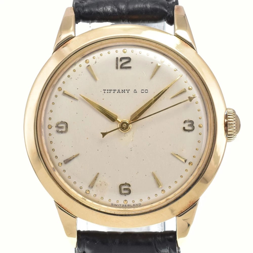 TIFFANY&CO. FRANCOIS VOGEL HAND WINDING WATCH: Tiffany&Co. Francois Vogel Hand Winding Watch Brand: TIFFANY&Co. Type/Style: Wristwatch Material: Band Material leather, Case Material K14YG Color: Case Color Yellow Gold, Band Color black, Dial Color
