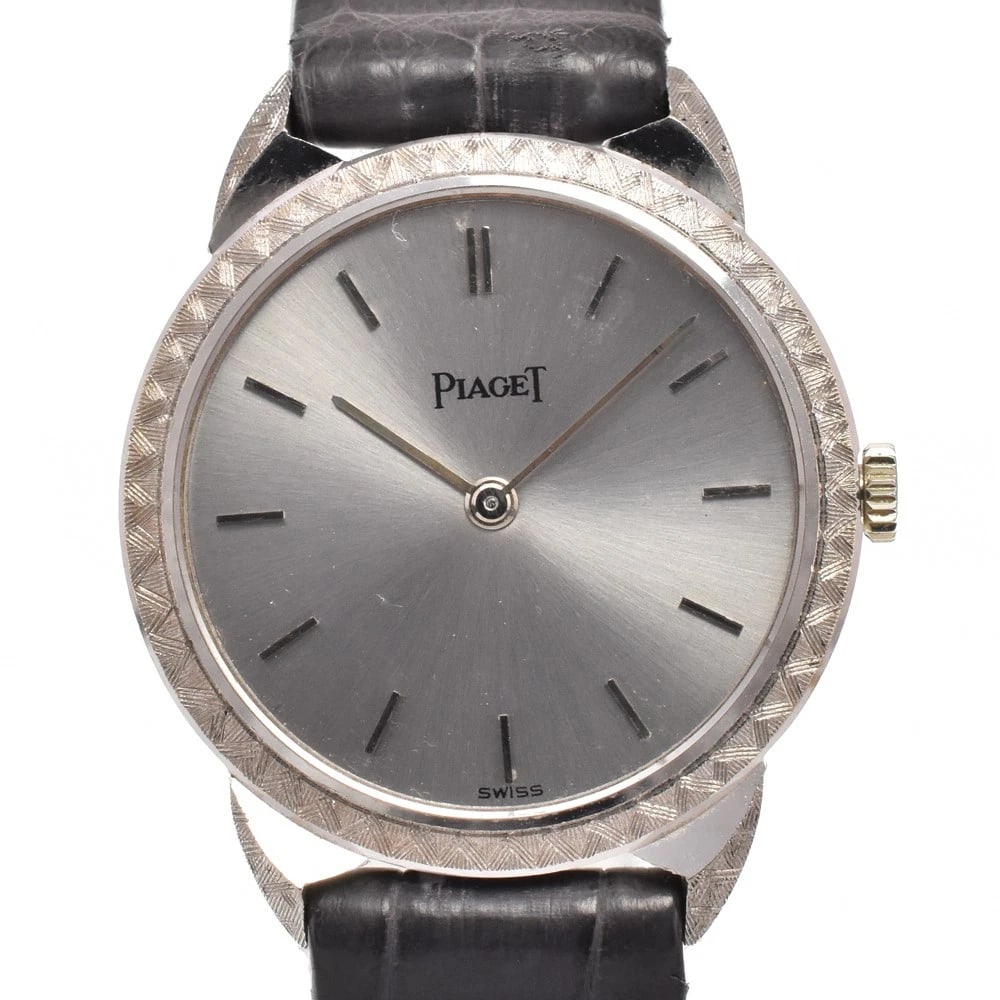 PIAGET DRESS K18WG HAND WINDING WATCH: Piaget Dress K18Wg Hand Winding Watch Brand: PIAGET Type/Style: Wristwatch Material: Band Material leather, Case Material K18WG Color: Case Color Silver, Band Color black, Dial Color gray Size: Case S