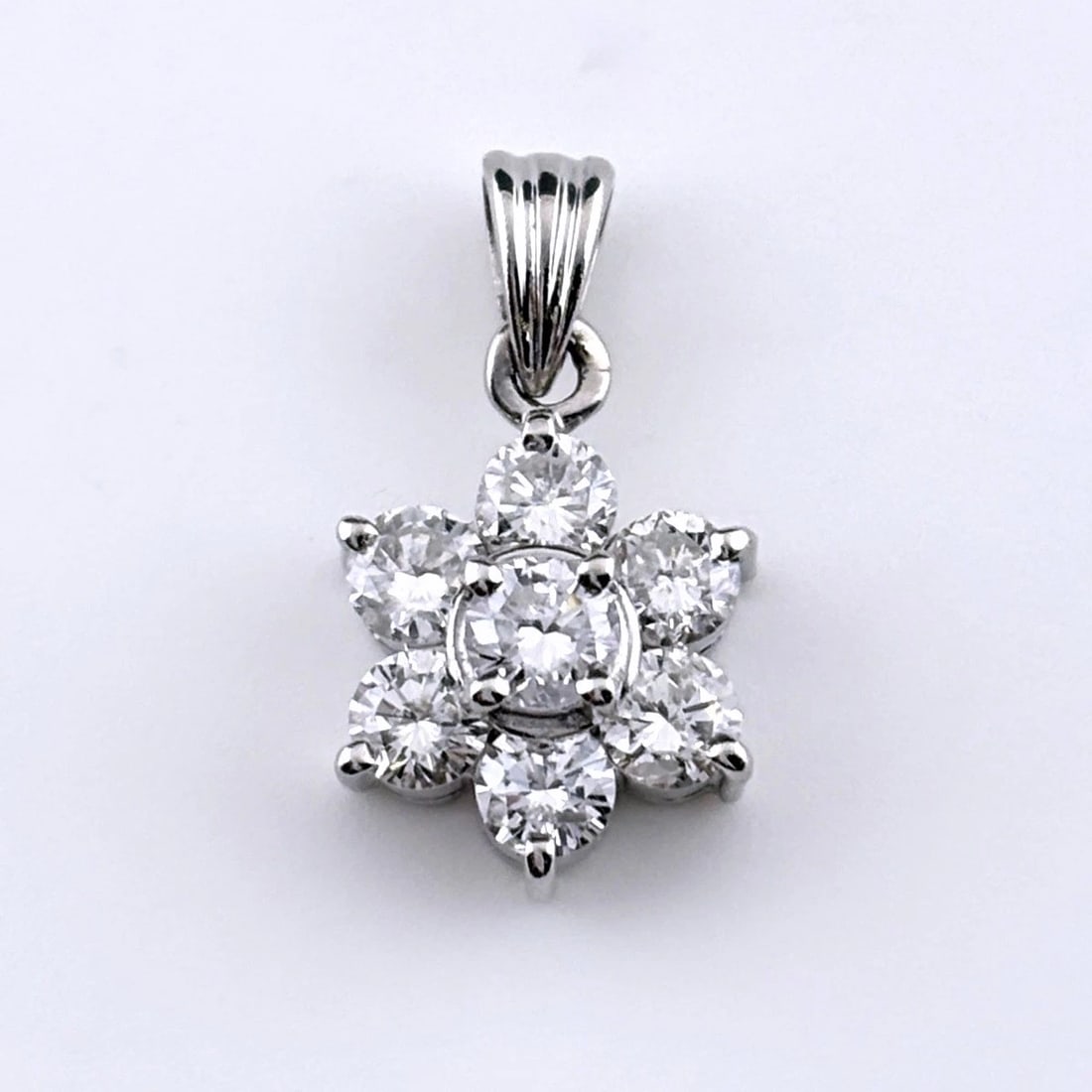 FLOWER MOTIF PENDANT HEAD: Flower motif Pendant Head Brand: Unbranded Type/Style: Pendant Head Material: Pt900, Main Stone Natural Color: Silver Size: Total length of the pendant head including a bail 18.0?9.7mm(0.7") Inside