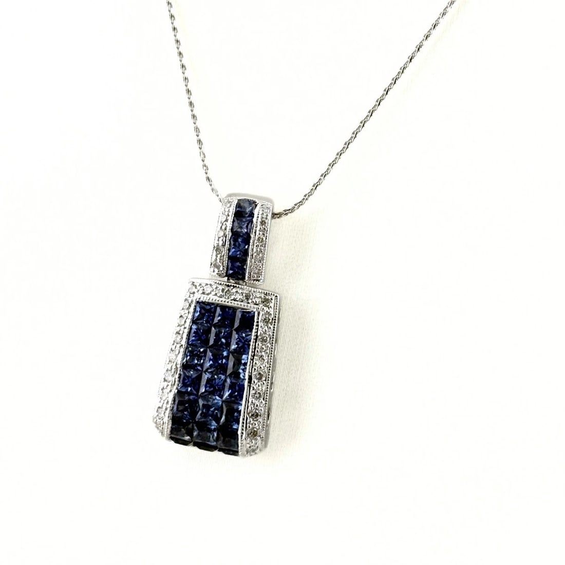 SAPPHIRE DESIGN NECKLACE: Sapphire design necklace Brand: Unbranded Type/Style: Necklace Material: 18K ?WG, Main Stone sapphire Color: WG Size: Chain / code 40cm(15.7") Chain width 0.6mm(0.0") Pendant size 26.5?11.8mm(1.0")