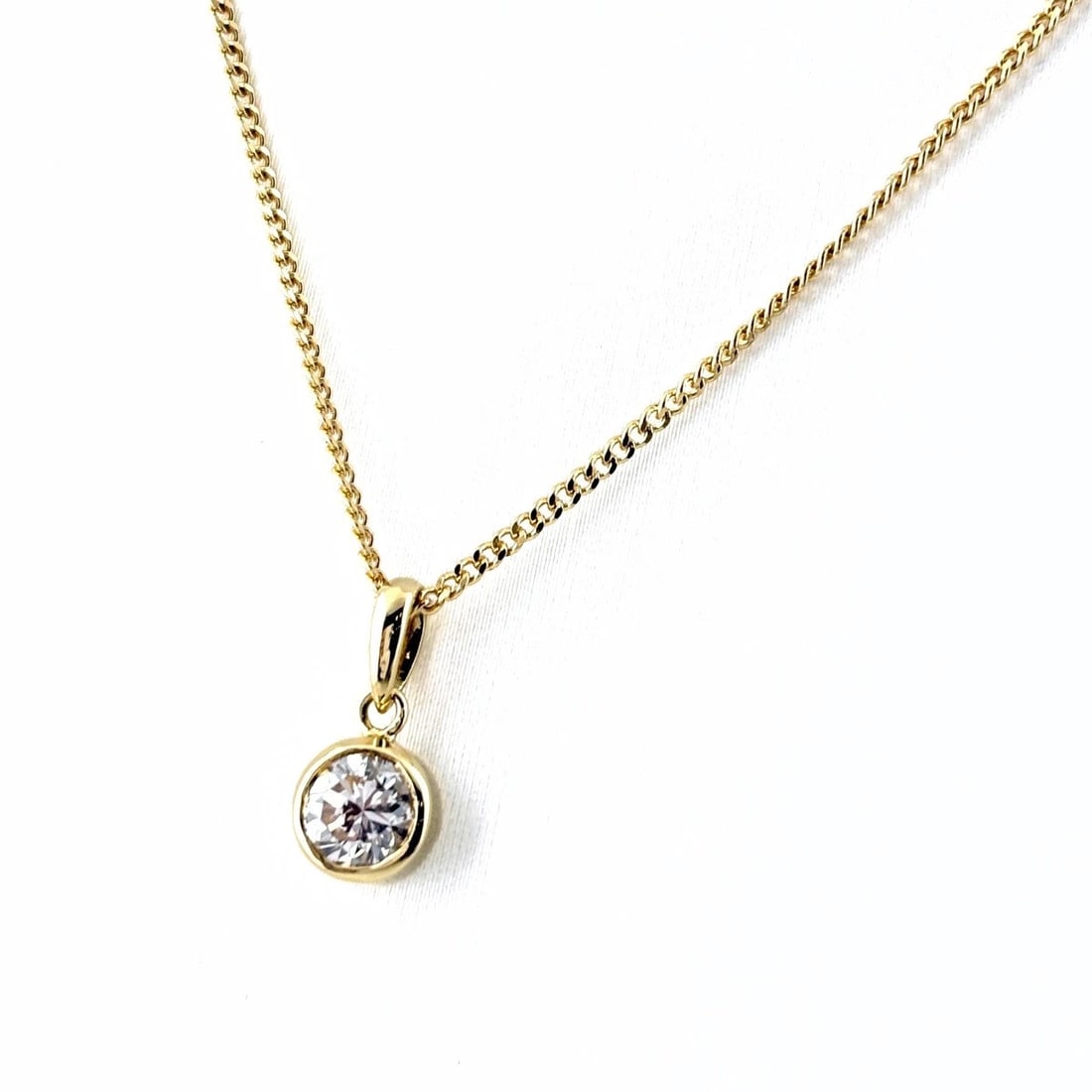 DIAMOND DESIGN NECKLACE: Diamond design necklace Brand: Unbranded Type/Style: Necklace Material: 18K YG, Color: YG Size: Chain / code 40cm(15.7") Total length of the pendant head including a bail 12.9?6.1mm(0.5")
