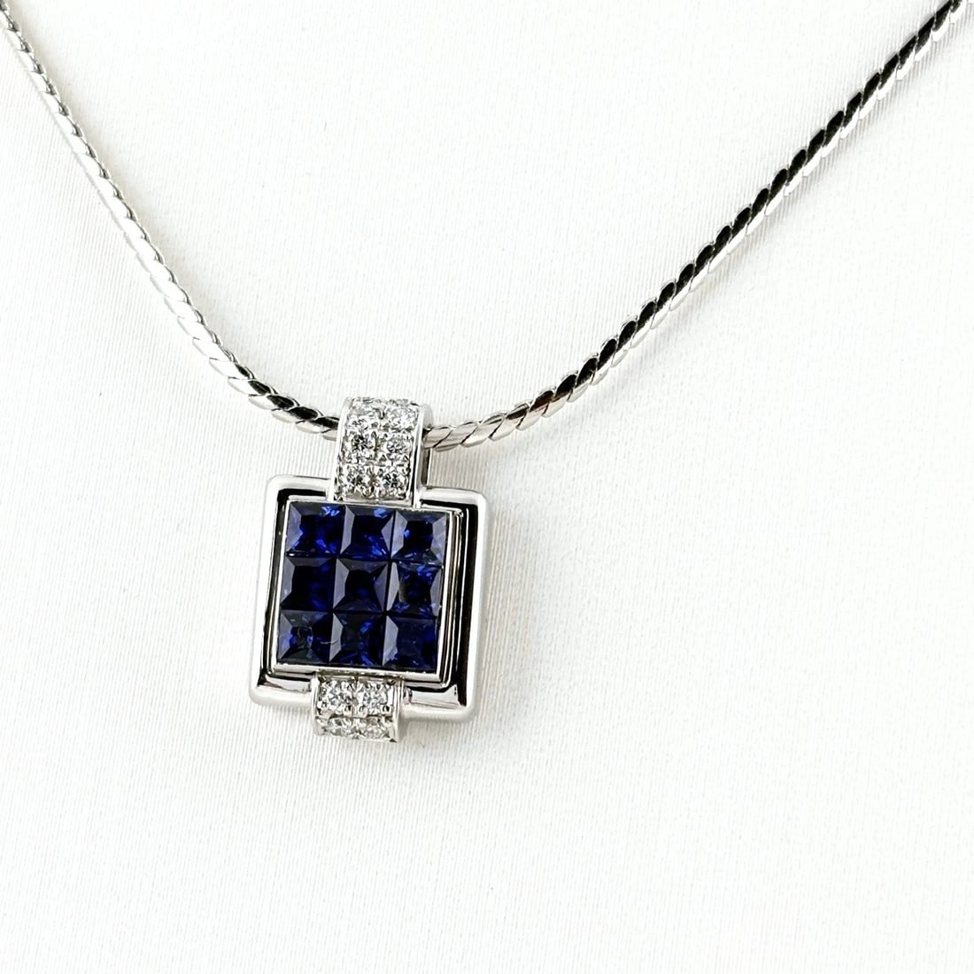 POLA SAPPHIRE NECKLACE PLATINUM PENDANT: POLA Sapphire necklace Platinum Pendant Brand: POLA Type/Style: Necklace Material: Pt900, Main Stone sapphire Color: PT Size: Chain / code 49cm(19.3") Pendant size 15.4?10.3mm(0.6") Accessories: None