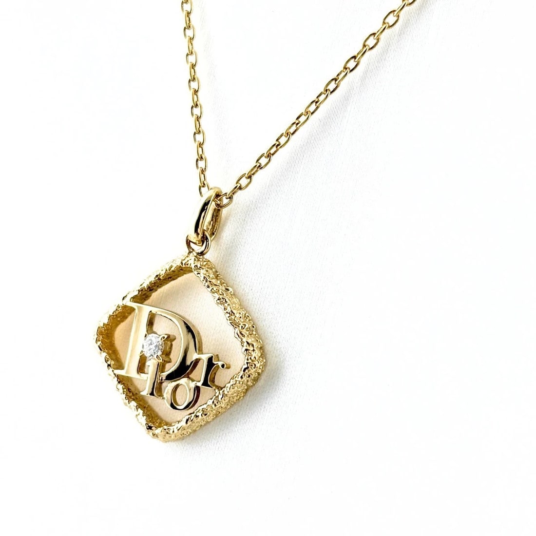 CHRISTIAN DIOR LOGO DIAMOND NECKLACE: Christian Dior Logo diamond Necklace Brand: Christian Dior Type/Style: Necklace Material: 18K YG, Color: YG Size: Chain / code 39cm(15.4") Total length of the pendant head including a bail