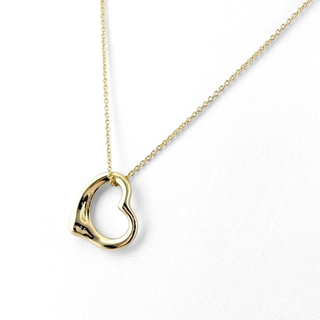 TIFFANY&CO. OPEN HEART NECKLACE: TIFFANY&Co. Open Heart Necklace Brand: TIFFANY&Co. Type/Style: Necklace Material: 18K YG, Color: YG Size: Chain / code 41cm(16.1") Pendant size 13.6?15.5mm(0.5") Accessories: None Accessor