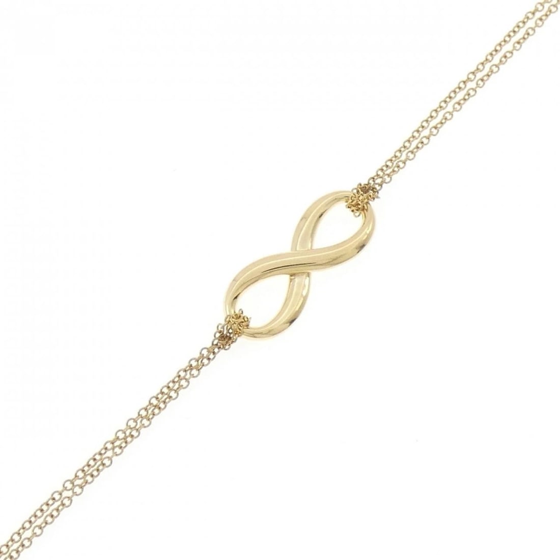 TIFFANY & CO. INFINITY BRACELET: TIFFANY & Co. Infinity Bracelet Brand: TIFFANY&Co. Type/Style: TIFFANY & Co. Bracelet Material: 750 yellow gold, Color: yellow gold Size: Length17cm Actual Size Max width approx.: 7.9mm Accessories: