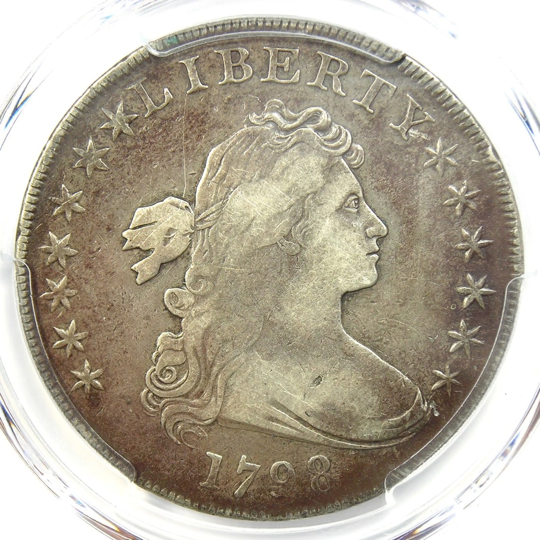 1798 DRAPED BUST SILVER DOLLAR $1 COIN: 1798 Draped Bust Silver Dollar $1 Coin Year: 1798 Denomination: $1 Country of Origin: United States Accessories: None Accessories Notice: When purchasing pre-owned goods, please refer to the photos of