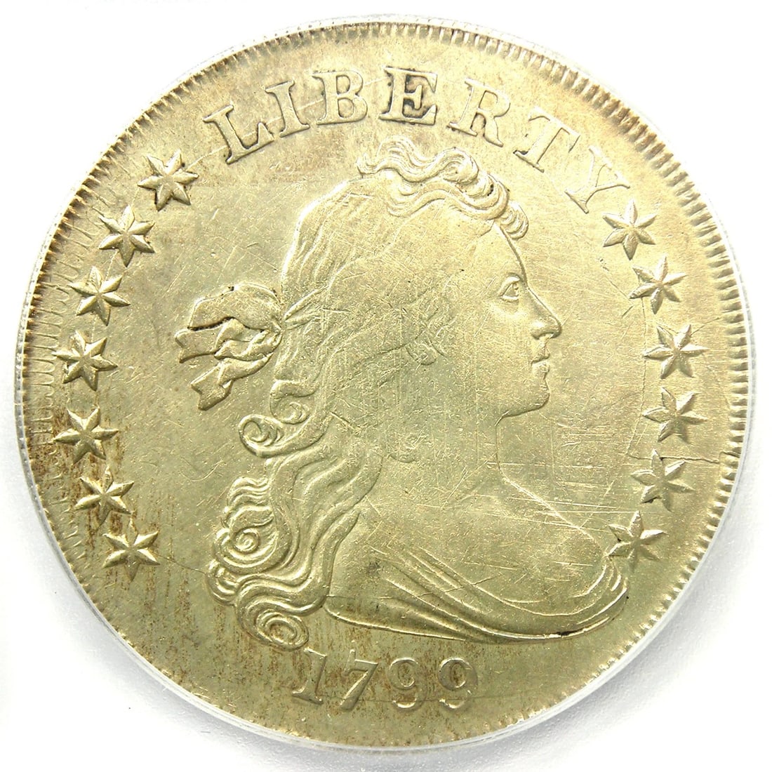 1799 DRAPED BUST SILVER DOLLAR $1 COIN: 1799 Draped Bust Silver Dollar $1 Coin Year : 1799 Denomination : $1 Country of Origin : United States Accessories: None Accessories Notice: When purchasing pre-owned goods, please refer to the photos