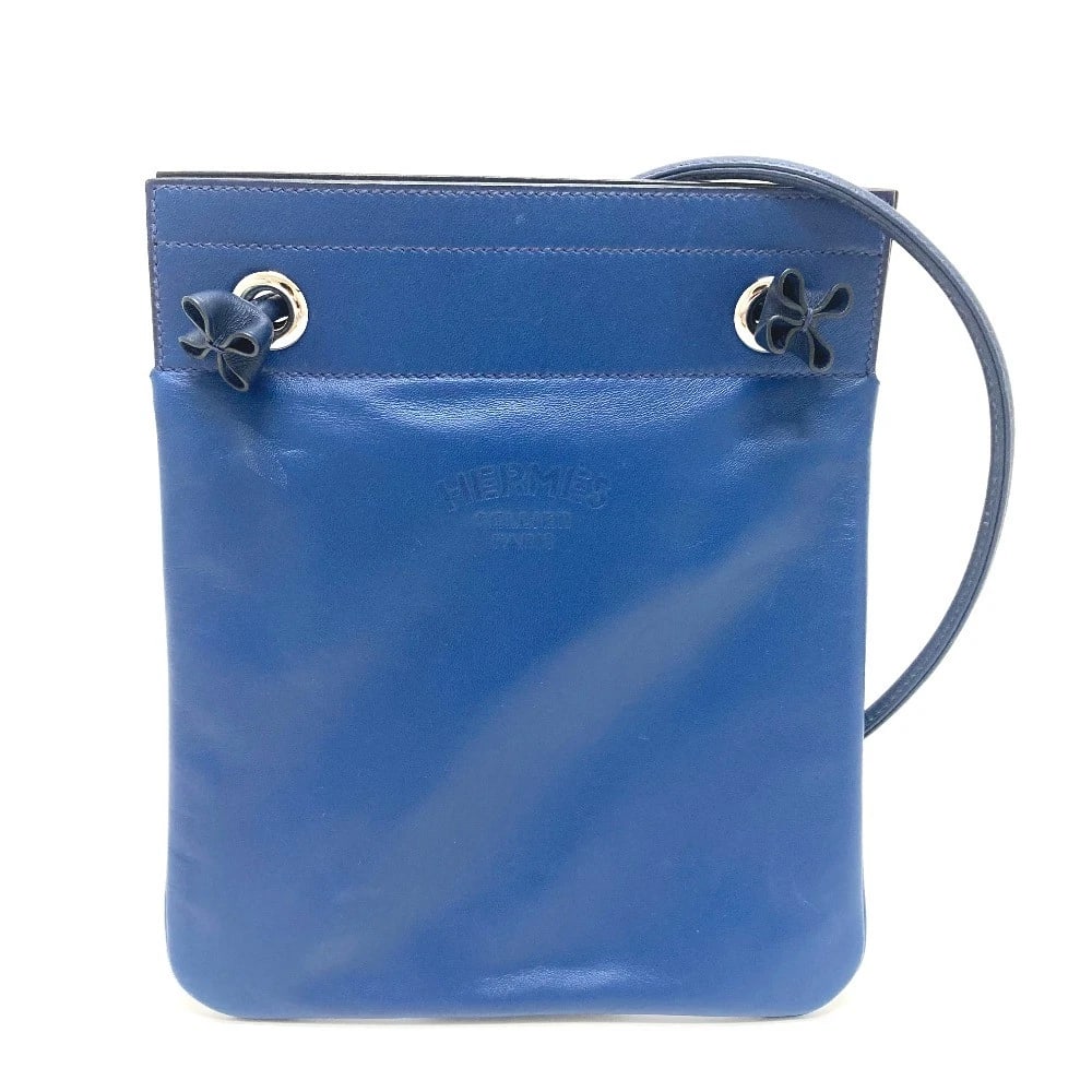 HERMES LEATHER ARINE MINI POCHETTE SHOULDER BAG: HERMES Leather Arine Mini Pochette Shoulder Bag Brand: HERMES Type/Style: Shoulder Bag Material: Swift Color: blue x Silver Hardware Size: W7.5xH9.1xD0.4inch / W19cmxH23cmxD1cm Accessories: None