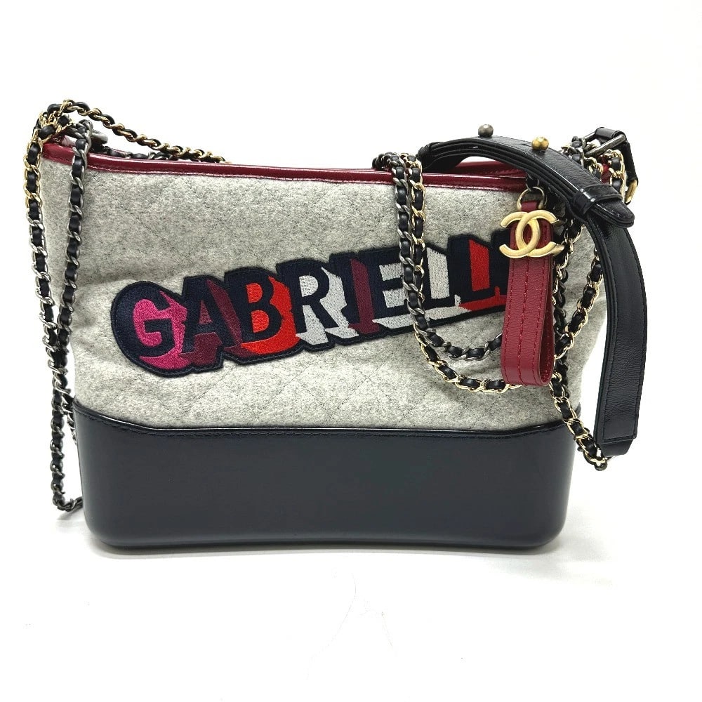 CHANEL CCCC MARK GABRIELLE DEUX CHAIN SHOULDER BAG: CHANEL CCCC Mark Gabrielle Deux Chain Shoulder Bag Brand: CHANEL Type/Style: Shoulder Bag Material: Calfskin / wool Color: Gray / Red Size: W10.6xH8.7xD3.9inch / W27cmxH22cmxD10cm Handle: 18.1inch / 4