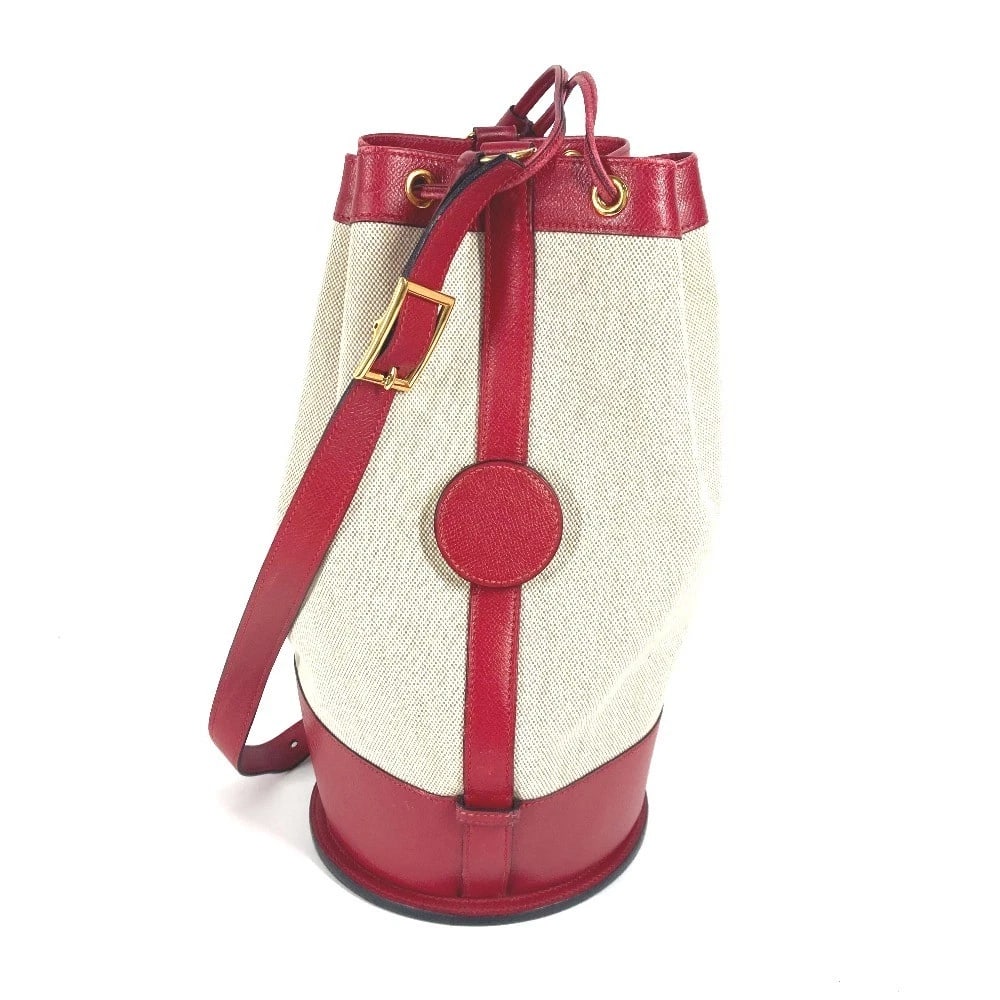 HERMES STANDY CROSSBODY DRAWSTRING SHOULDER BAG: HERMES Standy Crossbody Drawstring Shoulder Bag Brand: HERMES Type/Style: Shoulder Bag Material: Leather / Canvas Color: Red x Beige Size: W7.1xH13.6xD7.1inch / W18cmxH34.5cmxD18cm Accessories: No