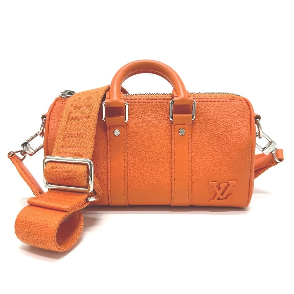 LOUIS VUITTON LV AEROGRAM KEEPALLXS BAG: LOUIS VUITTON LV Aerogram KeepallXS Bag Brand: LOUIS VUITTON Type/Style: Shoulder Bag Material: Leather Color: Orange Size: W8.3xH4.9xD3.5inch / W21cmxH12.5cmxD9cm Handle: 8.7inch / 22cm Accessori
