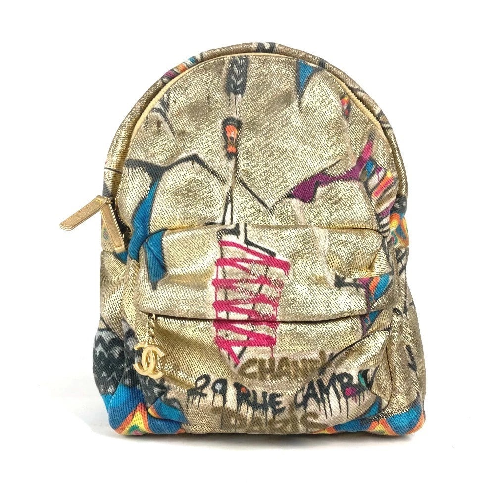 CHANEL CC MARK CC LOGO GRAFFITI BAG BACKPACK: CHANEL CC Mark CC logo graffiti bag Backpack Brand: CHANEL Type/Style: Backpack Material: Leather / Canvas Color: Gold Size: W10.6xH13.0xD4.3inch / W27cmxH33cmxD11cm Accessories: None Acce