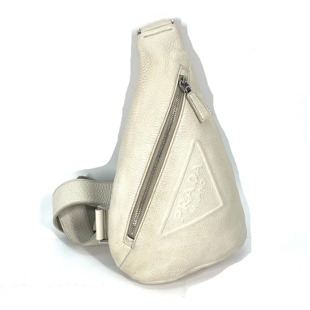 PRADA TRIANGLE LOGO CROSS VITELLO DINO LEATHER BAG: PRADA triangle logo Cross Vitello Dino Leather Bag Brand: PRADA Type/Style: body bag Material: Leather Color: Off White / White Size: W6.7xH11.8xD2.2inch / W17cmxH30cmxD5.5cm Accessories: None