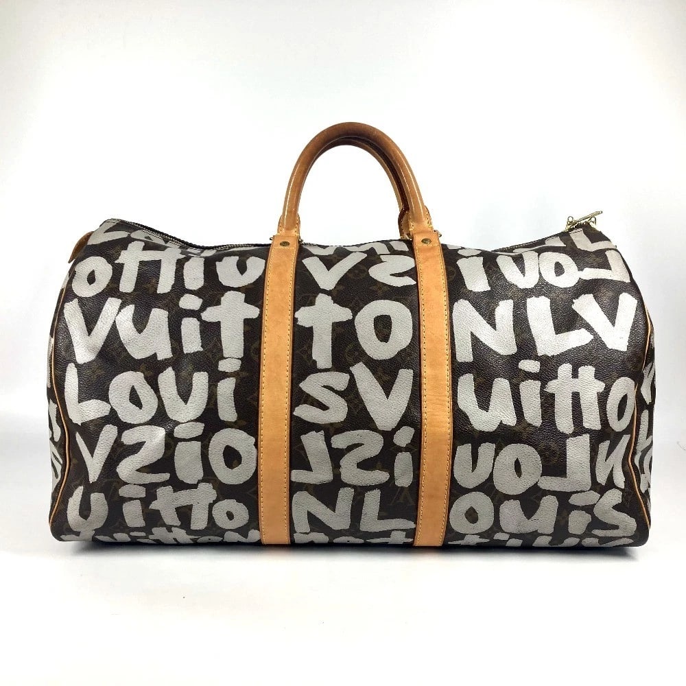 LOUIS VUITTON MONOGRAM GRAFFITI KEEPALL50 DUFFLE TRAVEL BAG: LOUIS VUITTON Monogram Graffiti Keepall50 Duffle Travel Bag Brand: Louis Vuitton Type/Style: Duffle Bag Material: Monogram graffiti Canvas Color: Brownxwhite Size: W19.9xH10.2xD8.3inch / W50.5cmxH26cm