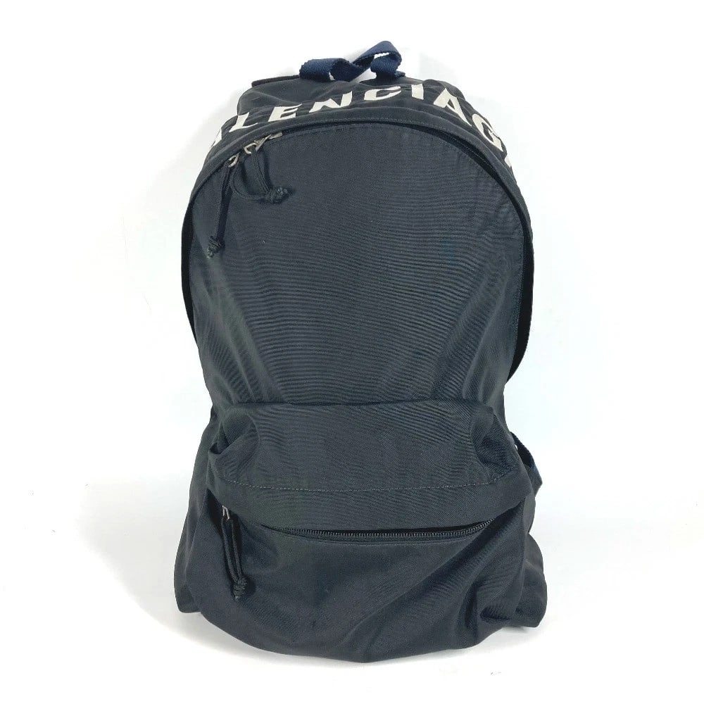 BALENCIAGA BICOLOR WHEEL LOGO BAG BACKPACK: BALENCIAGA Bicolor wheel logo bag Backpack Brand: BALENCIAGA Type/Style: Backpack Material: Nylon Color: Black Size: W12.8xH18.9xD4.5inch / W32.5cmxH48cmxD11.5cm Accessories: None Accessories Notice: