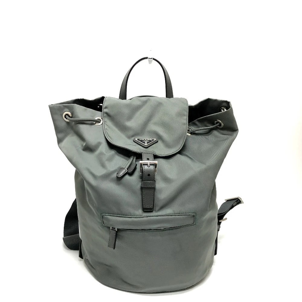 PRADA TRIANGLE LOGO BAG: PRADA Triangle logo bag Brand: PRADA Type/Style: Backpack Material: Leather Color: Gray / SilverHardware Size: W10.2xH13.8xD5.9inch / W26cmxH35cmxD15cm Accessories: None Accessories Notice