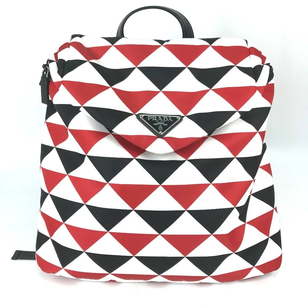 PRADA TRIANGLE LOGO PLATE SIGNEAU PRINT BAG BACKPACK: PRADA triangle logo plate Signeau print bag Backpack Brand: Type/Style: Backpack Material: Nylon Color: RedxWhite x Black Size: W15.4xH14.4xD4.7inch / W39cmxH36.5cmxD12cm Accessories: None