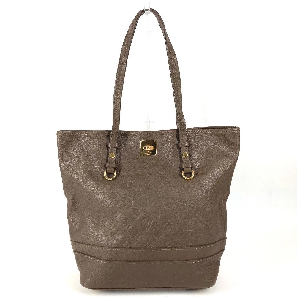 LOUIS VUITTON MONOGRAMEMPREINTE CITADIN PM SHOULDER BAG: LOUIS VUITTON MonogramEmpreinte Citadin PM Shoulder Bag Brand: Louis Vuitton Type/Style: Tote Bag Material: MonogramEmpreinteLeather Color: Omber / Brown Size: W10.6xH12.8xD5.7inch / W27cmxH32.5cmxD14