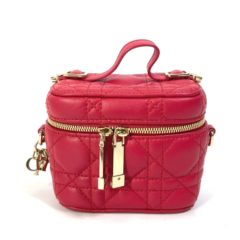 CHRISTIAN DIOR MICRO VANITY CANNAGE HAND BAG: CHRISTIAN DIOR Micro vanity Cannage Hand Bag Brand: Dior Type/Style: Vanity bag Material: Leather Color: RedBased Size: W4.1xH3.5xD2.6inch / W10.5cmxH9cmxD6.5cm Accessories: None Accessori