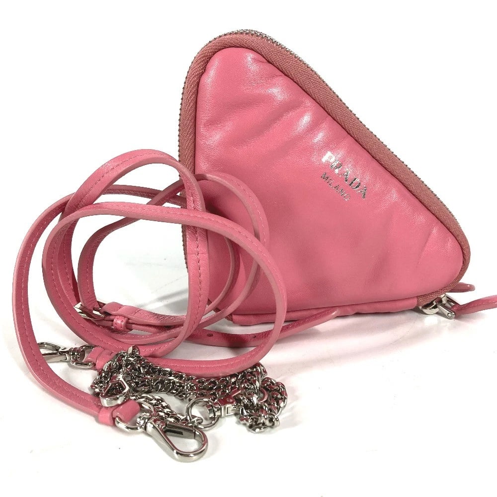 PRADA CHAIN DOUBLE TRIANGLE LOGO PLATE SHOULDER BAG: PRADA Chain Double Triangle Logo Plate Shoulder Bag Brand: PRADA Type/Style: Shoulder Bag Material: Leather Color: pink Size: W5.5xH3.9inch / W14cmxH10cm Shoulder longest: 49.2inch / 125cm Accesso