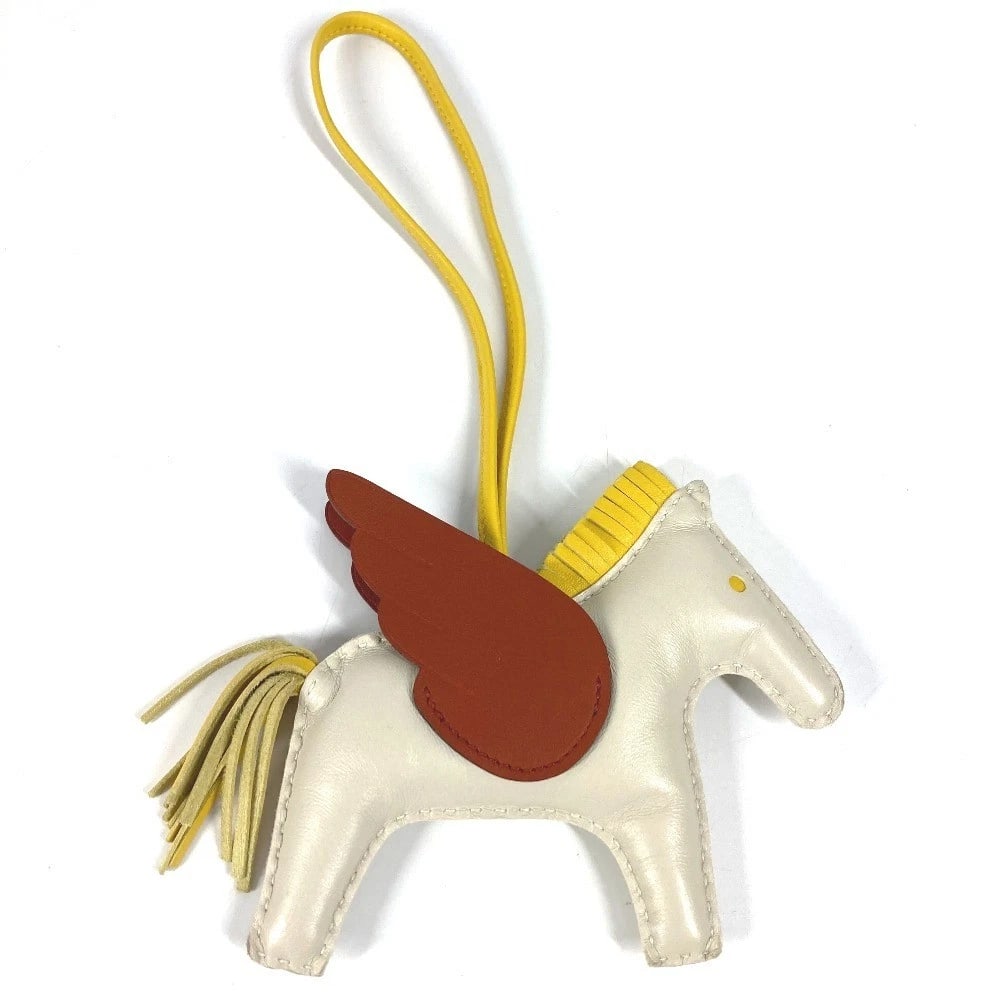 HERMES RODEO PEGASUS GM BAG: HERMES Rodeo Pegasus GM Bag Brand: HERMES Type/Style: charm Material: Anyo Miro Color: White Based x Yellow/Brown Size: W4.7inch / W12cm Total Length: 9.4inch / 24cm Accessories: None Acce