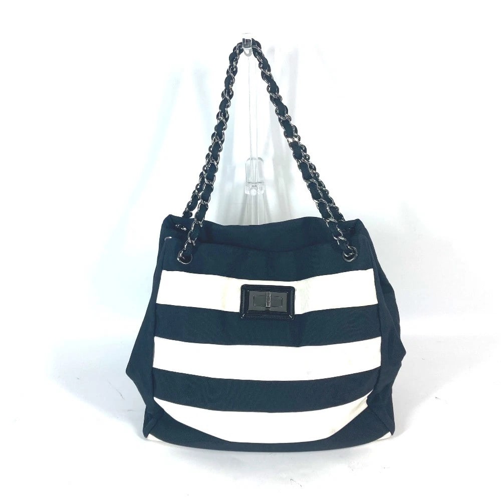 CHANEL METAL FITTINGS DOUBLE CHAIN SHOULDER BAG: CHANEL metal fittings Double Chain Shoulder Bag Brand: CHANEL Type/Style: Shoulder Bag Material: Nylon canvas Color: Black / White Size: W9.6xH11.0xD4.7inch / W24.5cmxH28cmxD12cm Accessories: None